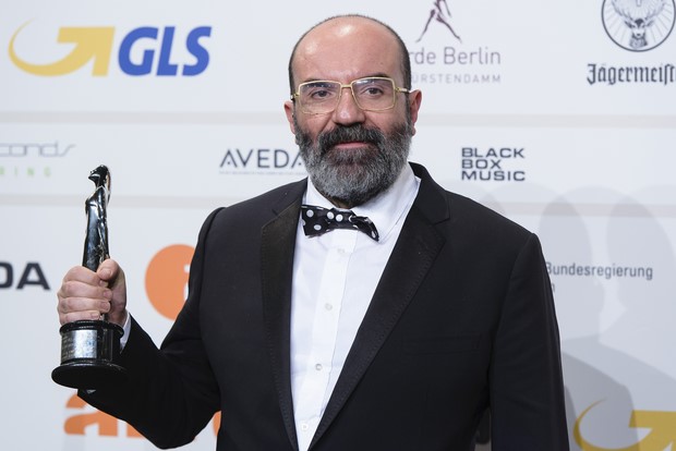 BERLIN, GERMANY - DECEMBER 07: Paco Delgado poses with his award for european costume designer at the European Film Awards 2013 on December 7, 2013 in Berlin, Germany. (Photo by Clemens Bilan/Getty Images)