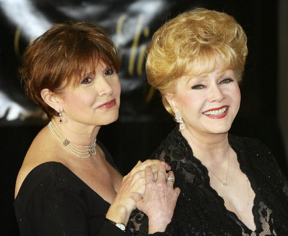 HENDERSON, NV - FEBRUARY 27: Actress Carrie Fisher (L) and her mother, actress Debbie Reynolds, arrive for Dame Elizabeth Taylor's 75th birthday party at the Ritz-Carlton, Lake Las Vegas on February 27, 2007 in Henderson, Nevada. (Photo by Ethan Miller/Getty Images)