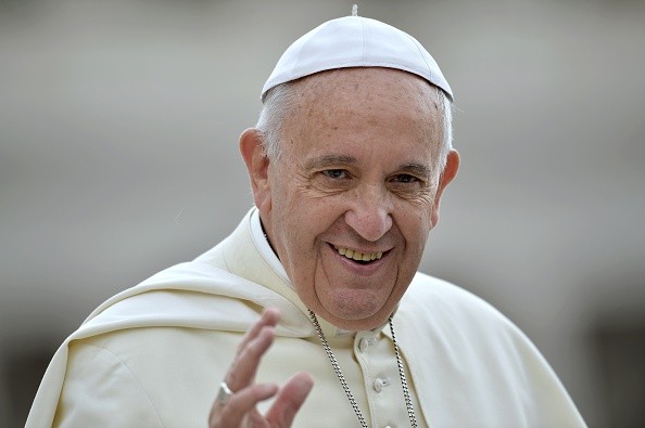 Pope Francis' waves as he arrives to lead the weekly audience in Saint Peter's Square at the Vatican on June 24, 2015. AFP PHOTO / FILIPPO MONTEFORTE (Photo credit should read FILIPPO MONTEFORTE/AFP/Getty Images)