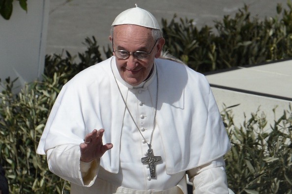 Pope Francis waves to the crowd from the papamobile after a mass on St Peter's square as part of the Palm Sunday celebration on March 24, 2013 at the Vatican. The Palm Sunday marks the start of the holy week of Easter in celebration of the crucifixion and resurrection of Jesus Christ. AFP PHOTO / FILIPPO MONTEFORTE (Photo credit should read FILIPPO MONTEFORTE/AFP/Getty Images)