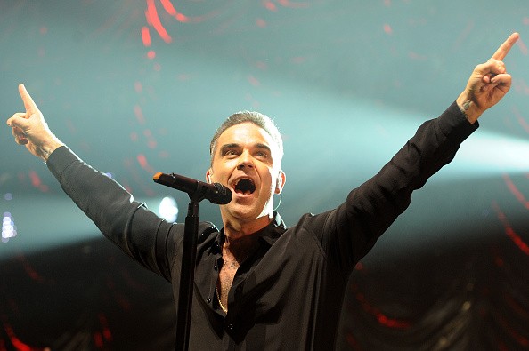 MANCHESTER, ENGLAND - DECEMBER 09: Robbie Williams performs on stage at Key 103 Christmas Live at Manchester Arena on December 9, 2016 in Manchester, England. (Photo by Shirlaine Forrest/Getty Images)